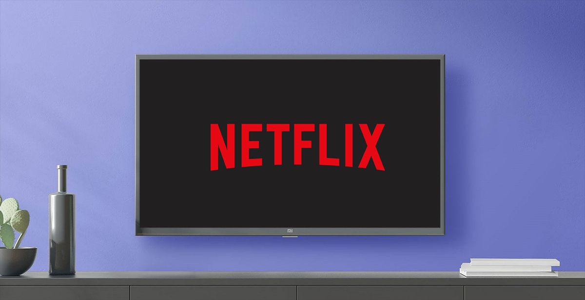 Netflix logo on TV mounted on blue wall