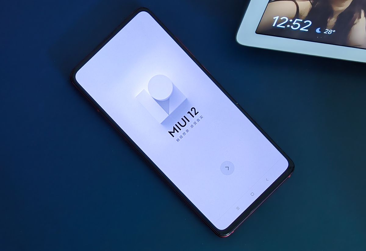 MIUI 12 logo on Xiaomi device kept on blue background