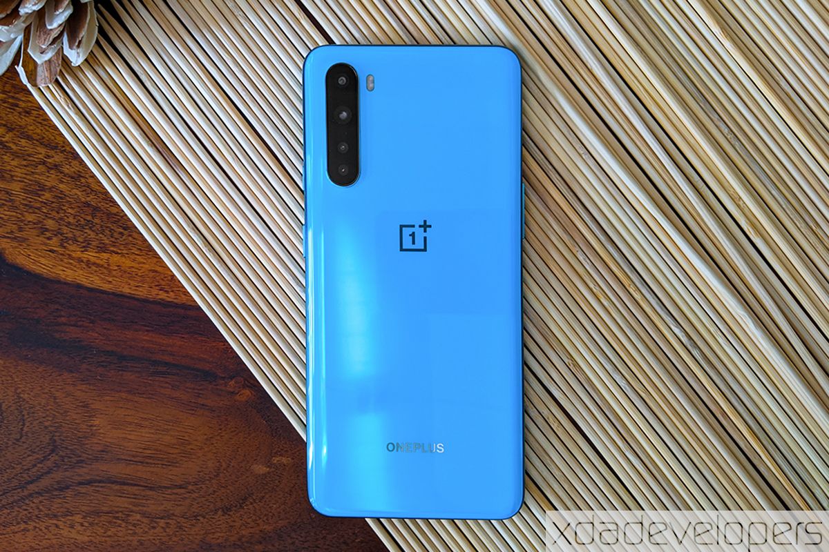 Blue OnePlus Nord on wood grain background