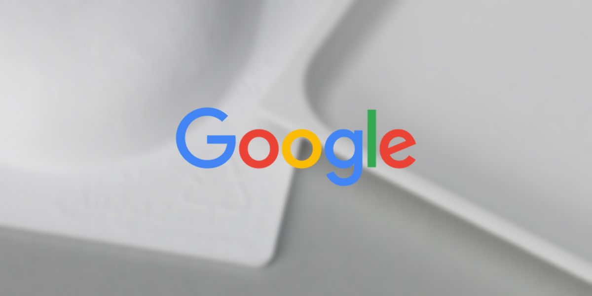 Google logo on blurred background with packaging materials