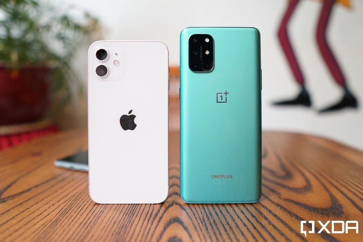 white iPhone 12 and green OnePlus 8T.
