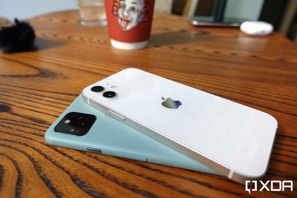 Google Pixel 5 Blue and Apple iPhone 12 White placed on a table