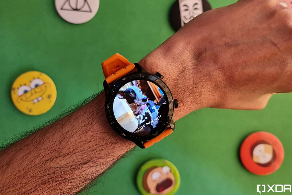 Realme Watch S Pro with orange strap on wrist