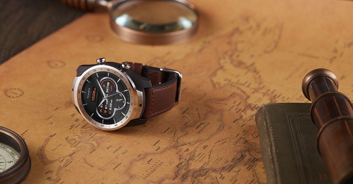 ticwatch pro 2020 edition on table with a map and explorer gear