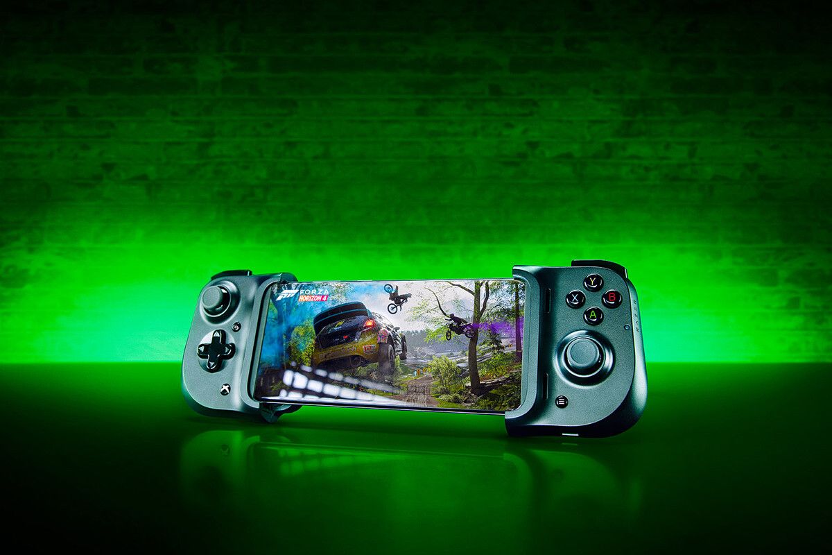 Razer Kishi Xbox controller holding phone on green background