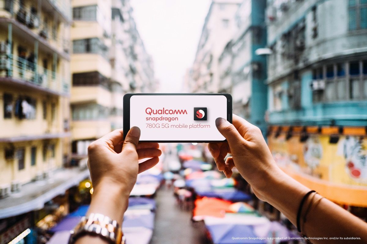 Woman's hand taking a photo of local city street view in Hong Kong with smartphone with Qualcomm Snapdragon 780G
