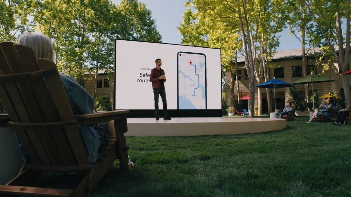 Sundar Pichai standing in front of a Google Maps slide at I/O