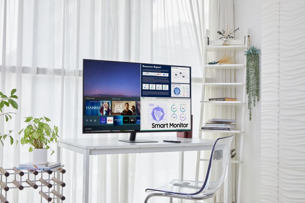 Samsung Smart Monitor with remote control on white desk