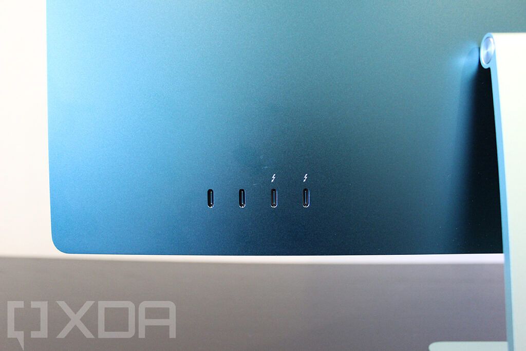 Close-up of USB ports on green 24-inch iMac