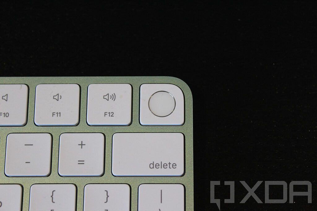 Close-up of Touch ID on green Magic Keyboard