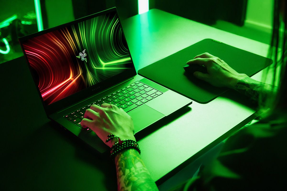 Razer Blade 14 on desk with green lighting