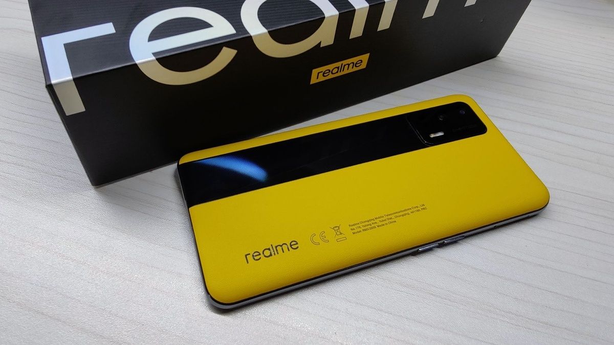 Realme GT dual-tone leather variant lying beside its box