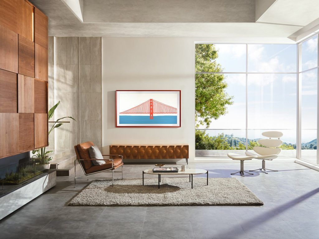 Samsung Frame TV 2021 in living room with modern chairs, coffee table and rug