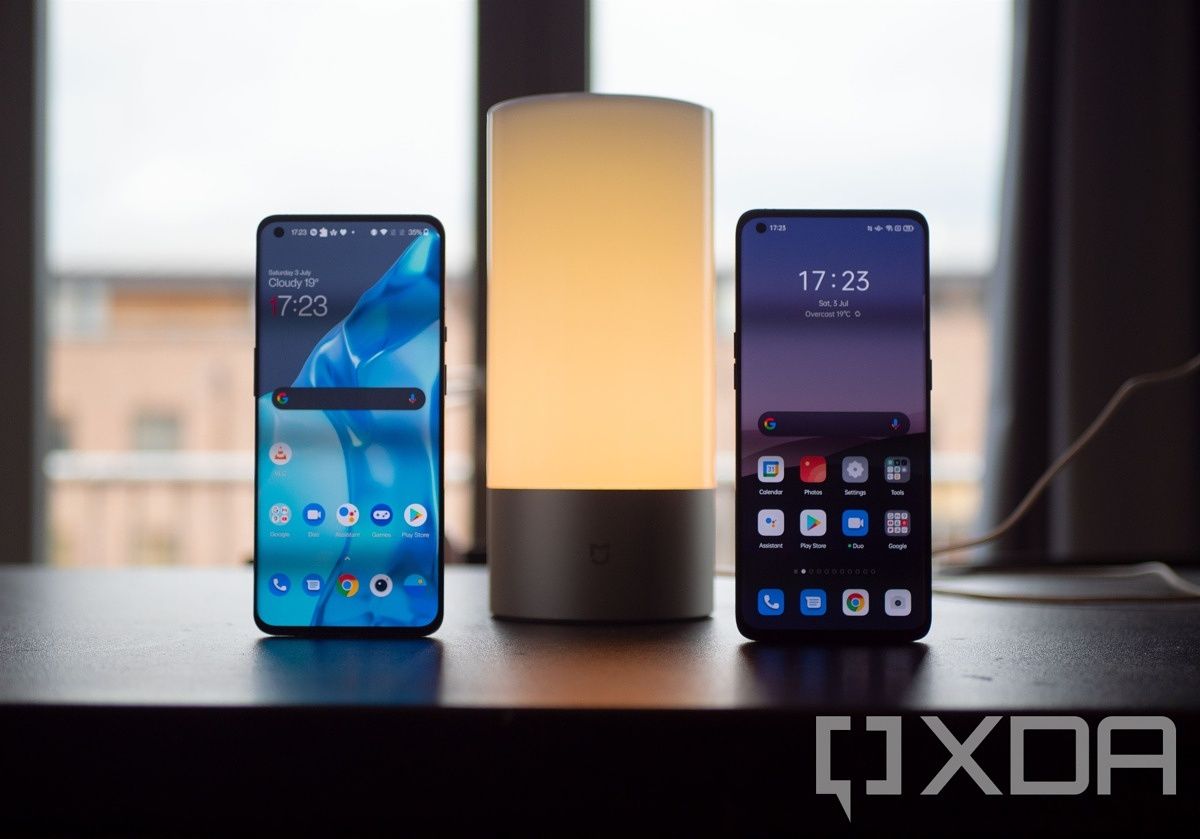 OnePlus 9 Pro and OPPO Find X3 Pro shown besides a table lamp
