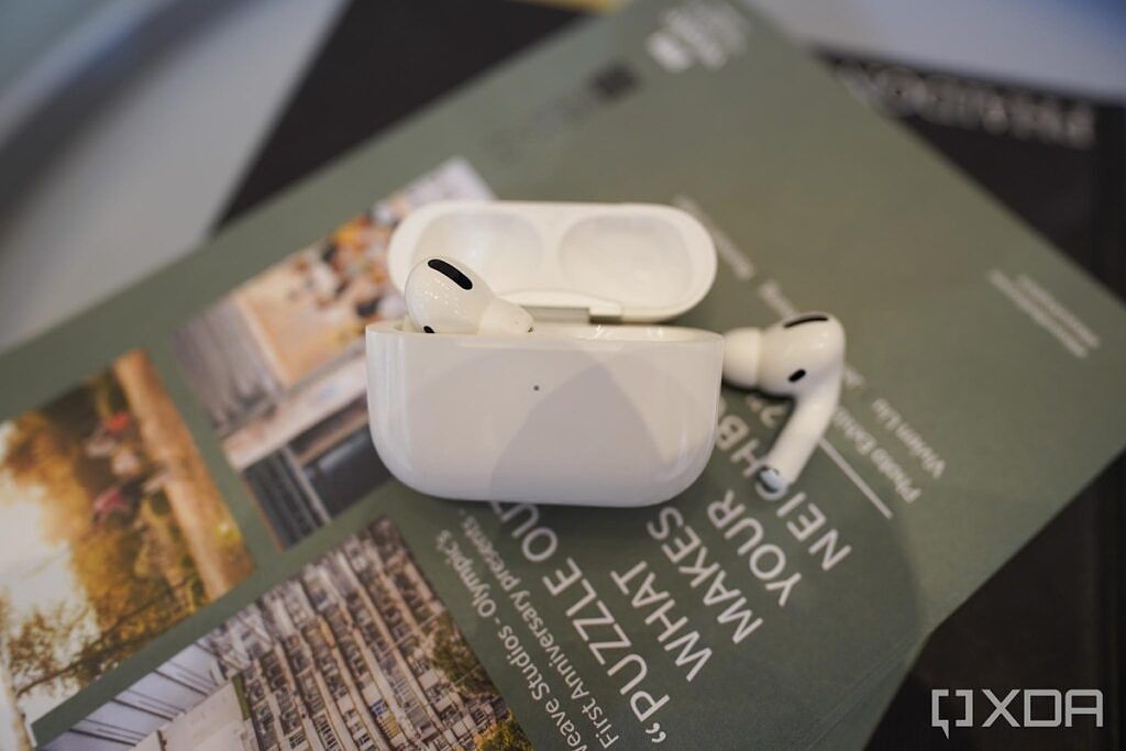 Apple AirPods Pro on a stack of magazines. 