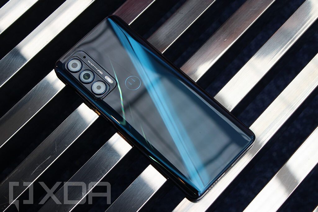 Motorola Edge 2021 with metal bars in background