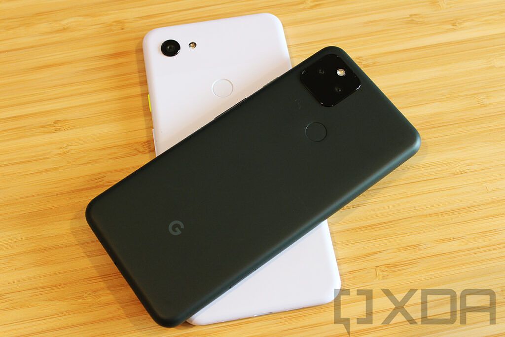 Google Pixel 5a on top of Pixel 3a XL on wooden table