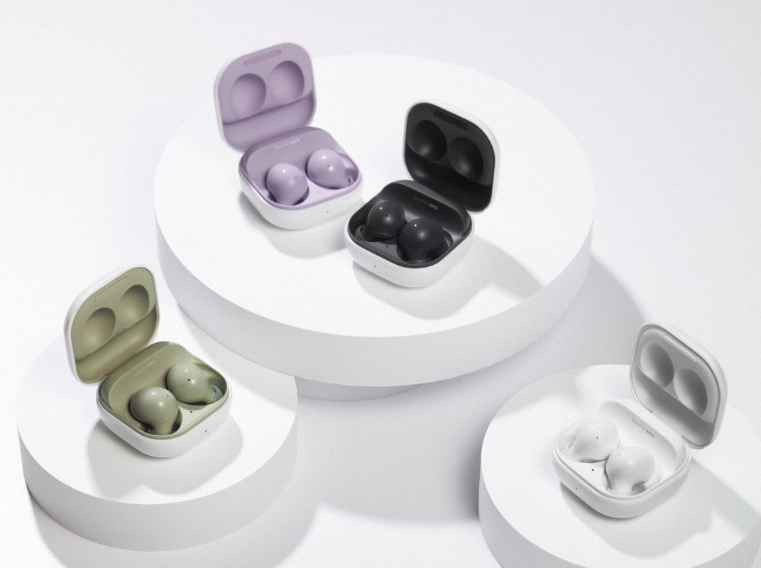 Samsung Galaxy Buds 2 in Graphite Black, Lavender Purple, Olive Green, and White, kept open in their cases