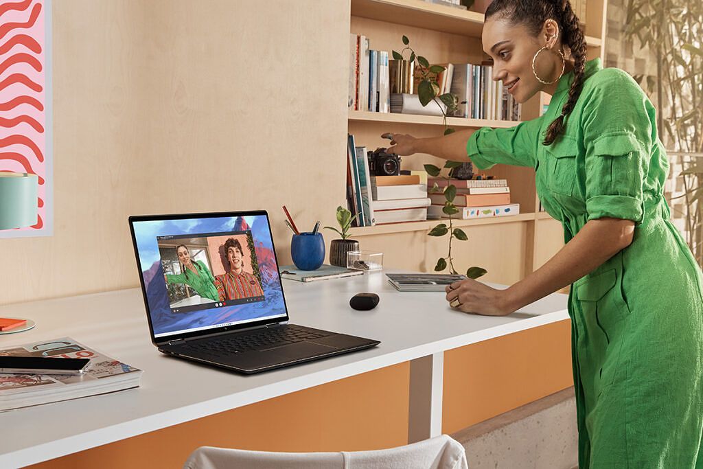 Woman standing in front of HP Spectre x360 16