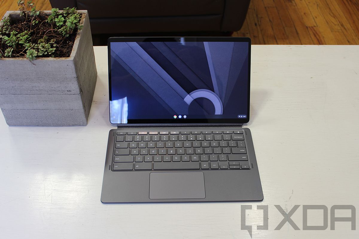 Lenovo Chromebook Duet 5 on white table next to plant