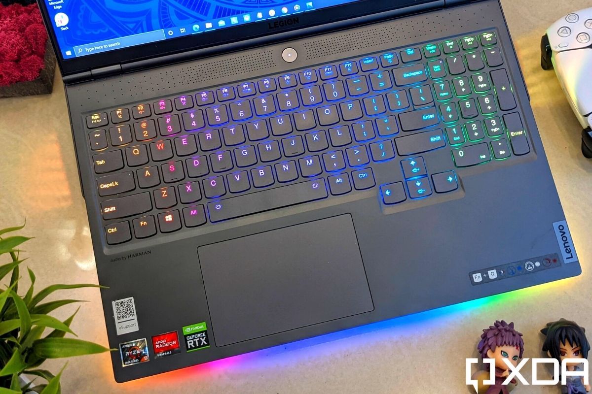 Keyboard deck of a grey colored laptop with RGB lights around the edge