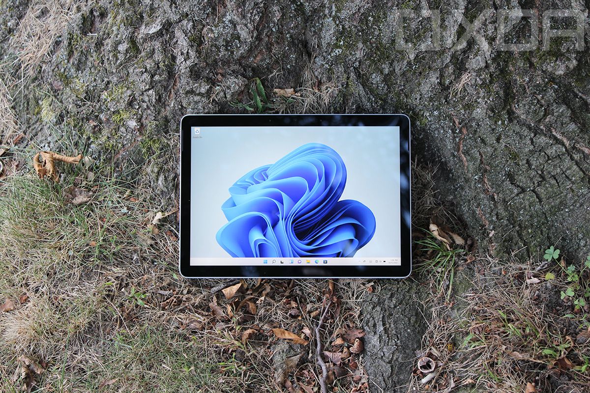 Front view of Surface Go 3 in front of a tree.