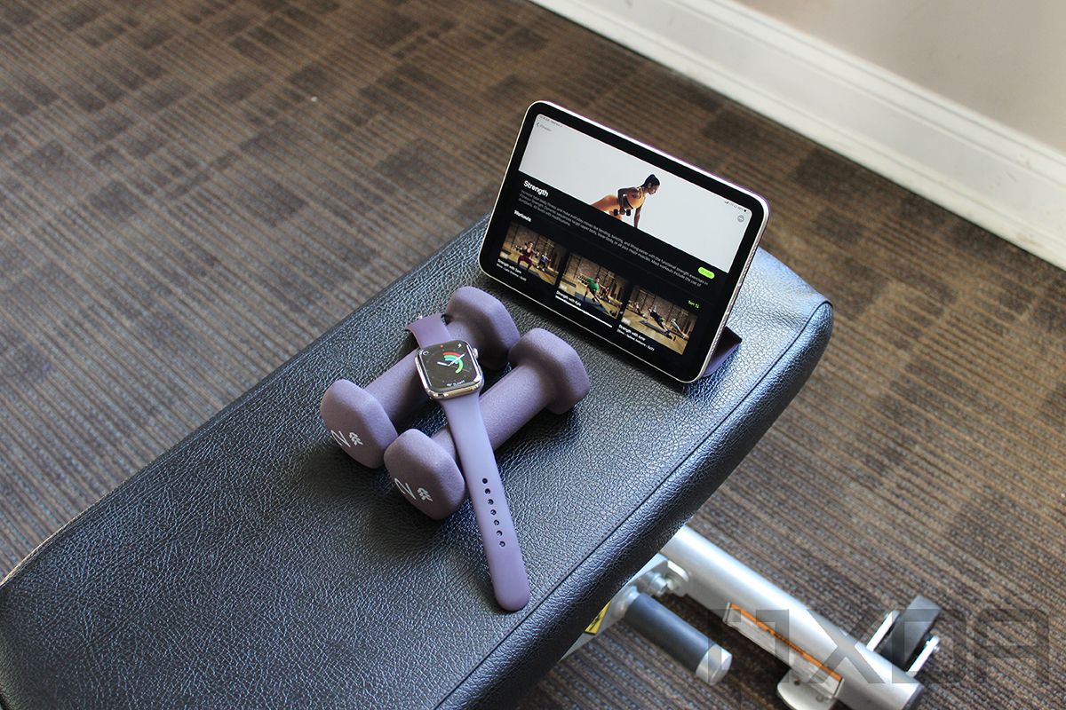 Apple Watch on dumbbells with iPad