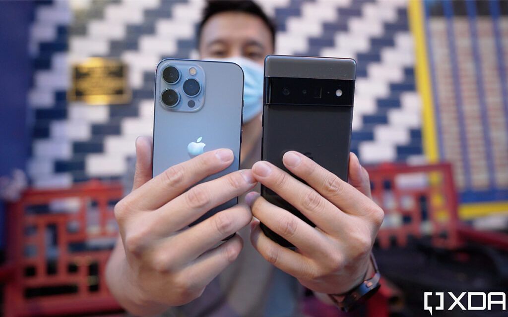 iPhone 13 Pro and Pixel 6 Pro in the hand.