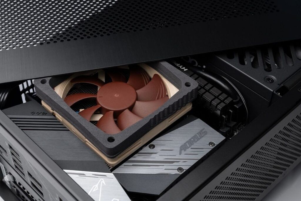 A noctua low profile cooler installed inside an SFF case with duct kits on top