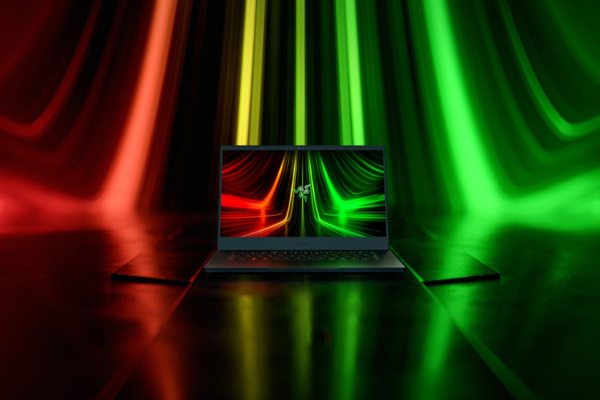 Razer Blade 14 with red and green lights behind it