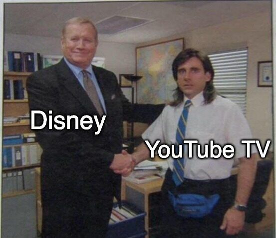 The Office screenshot, showing Ed Truck (with the caption of 'NBC Universal') shaking Michael Scott's hand as he looks confused (with the caption 'YouTube TV')