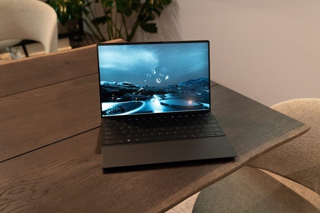 Black laptop on brown table