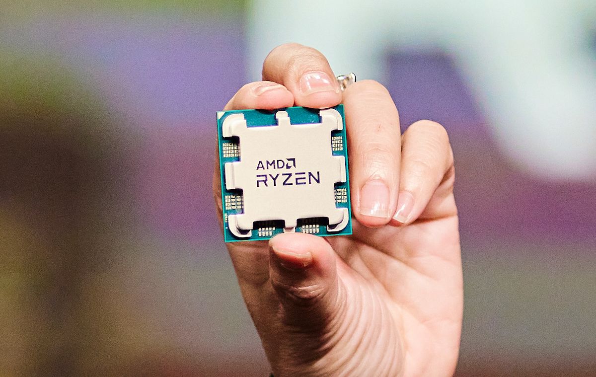 Hand holding AMD Ryzen branded processor