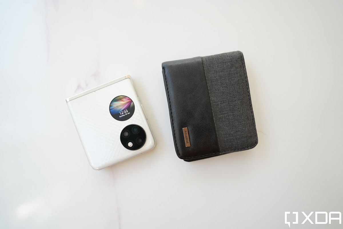 Huawei P50 Pocket next to a wallet