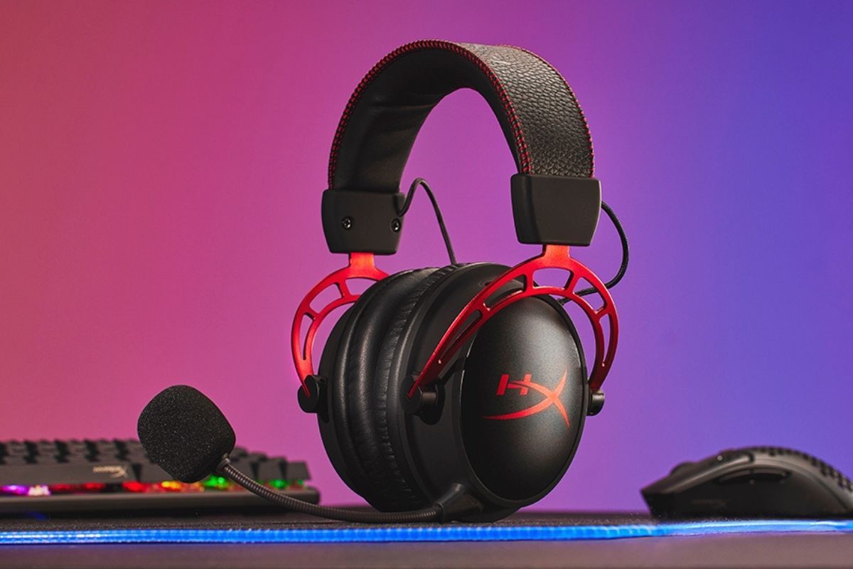 A black-colored gaming headset with red accents kept on a table