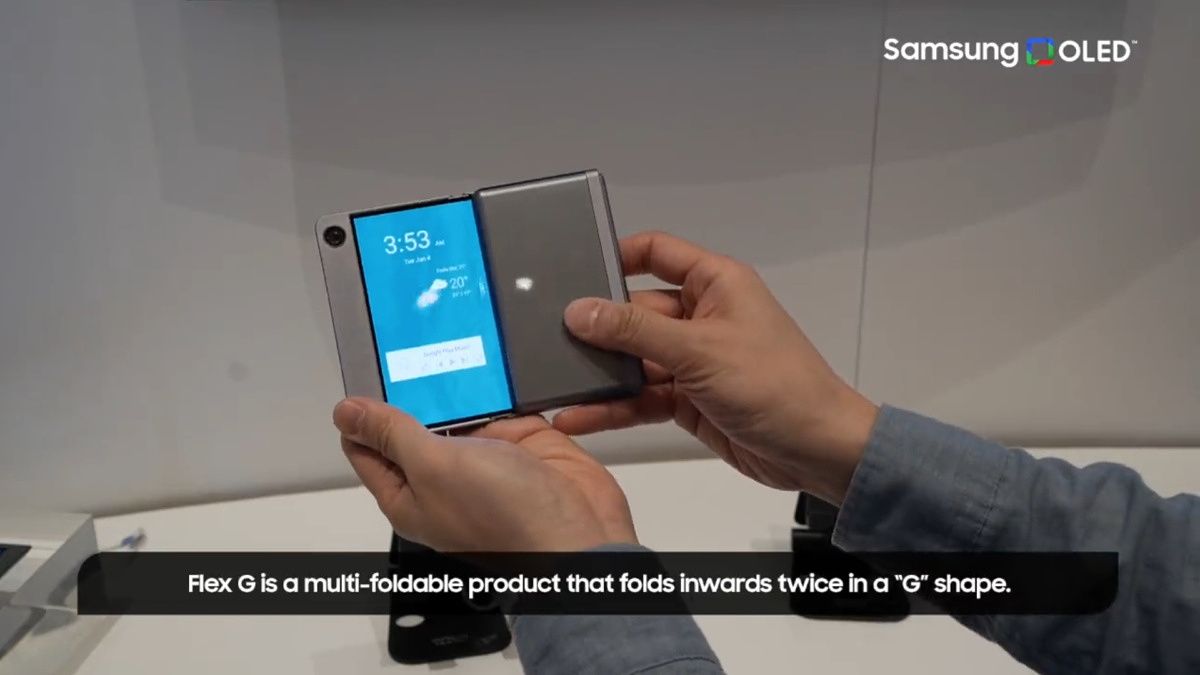 A person holding a Samsung foldable phone in hand