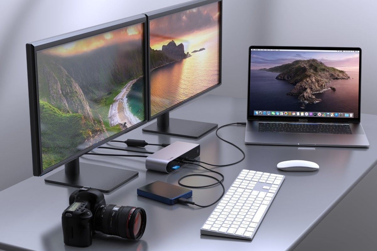 Desk setup with a laptop and multiple peripherals connected to the Belkin Connect Pro dock