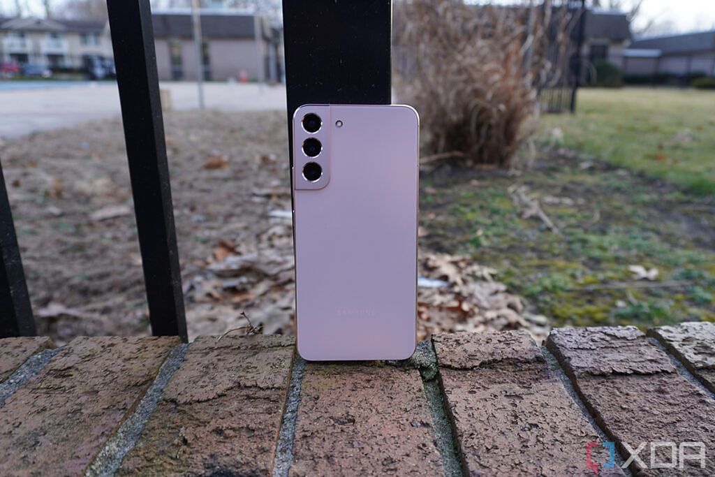 Pink smartphone on brick