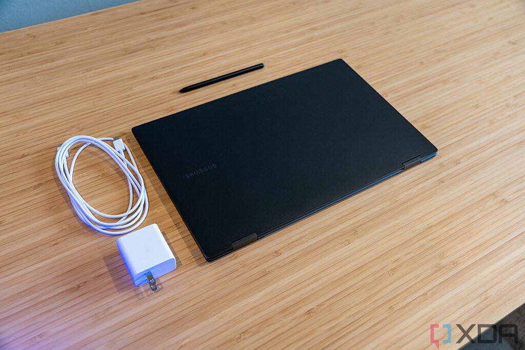 Laptop with charging cable and pen