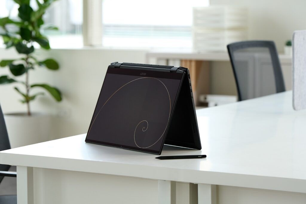 MSI Summit E16 Flip laptop in tent mode on a desk