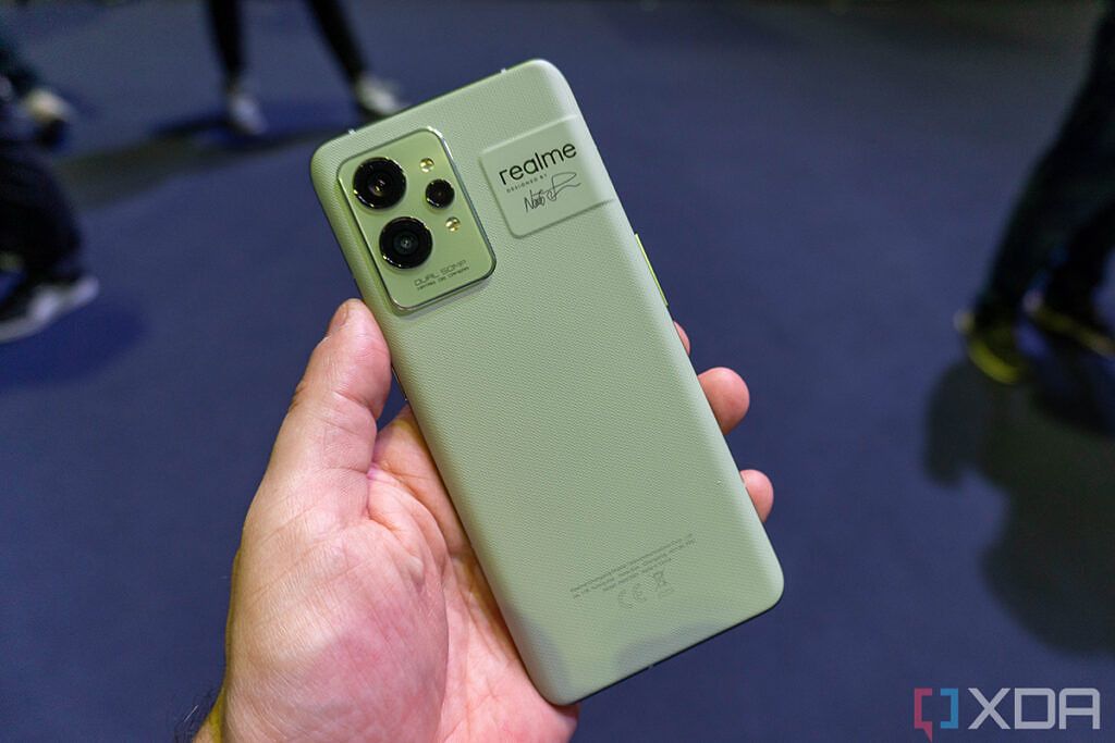 Green Realme GT 2 Pro in hand