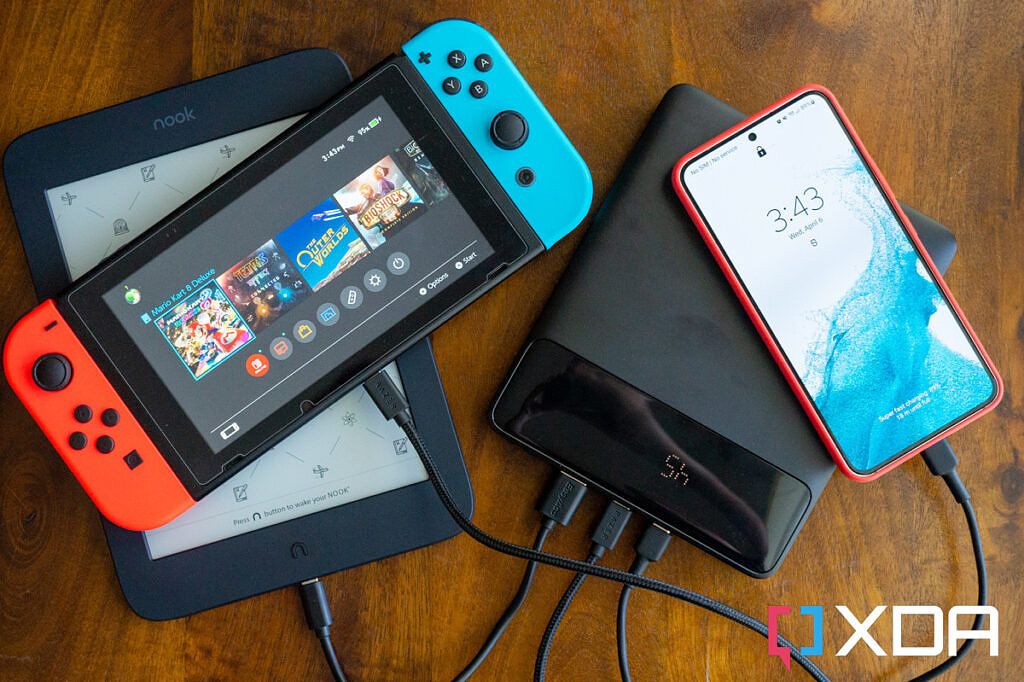 Battery charging a Nintendo Switch, Nook e-reader, and Galaxy S22