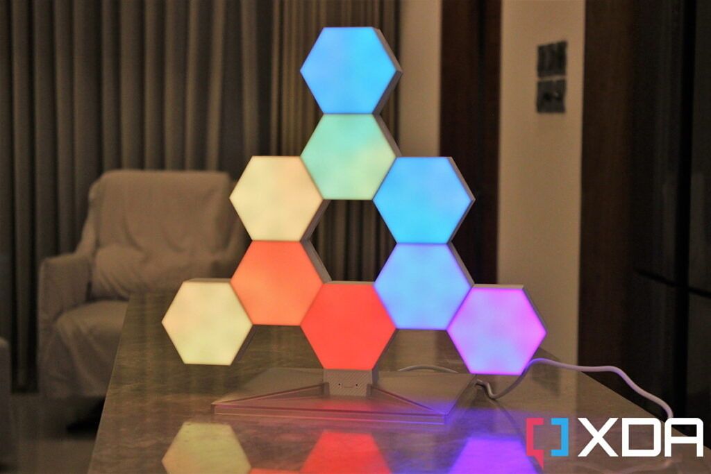 Cololight Hexagon Light Plus Kit assembled in a triangular pattern while displaying multiple colors