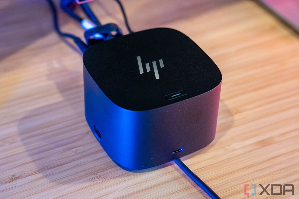 HP dock on wooden desk with wires connected