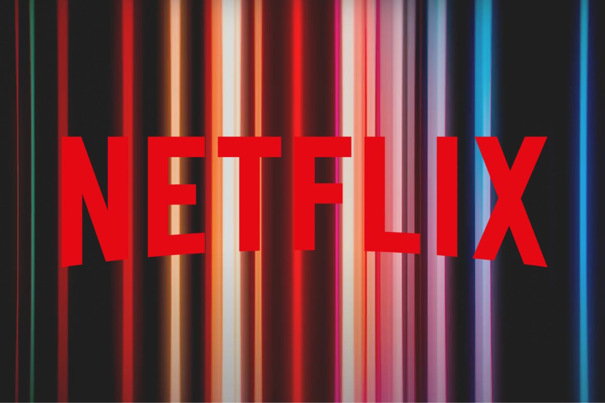Netflix logo on rainbow background.