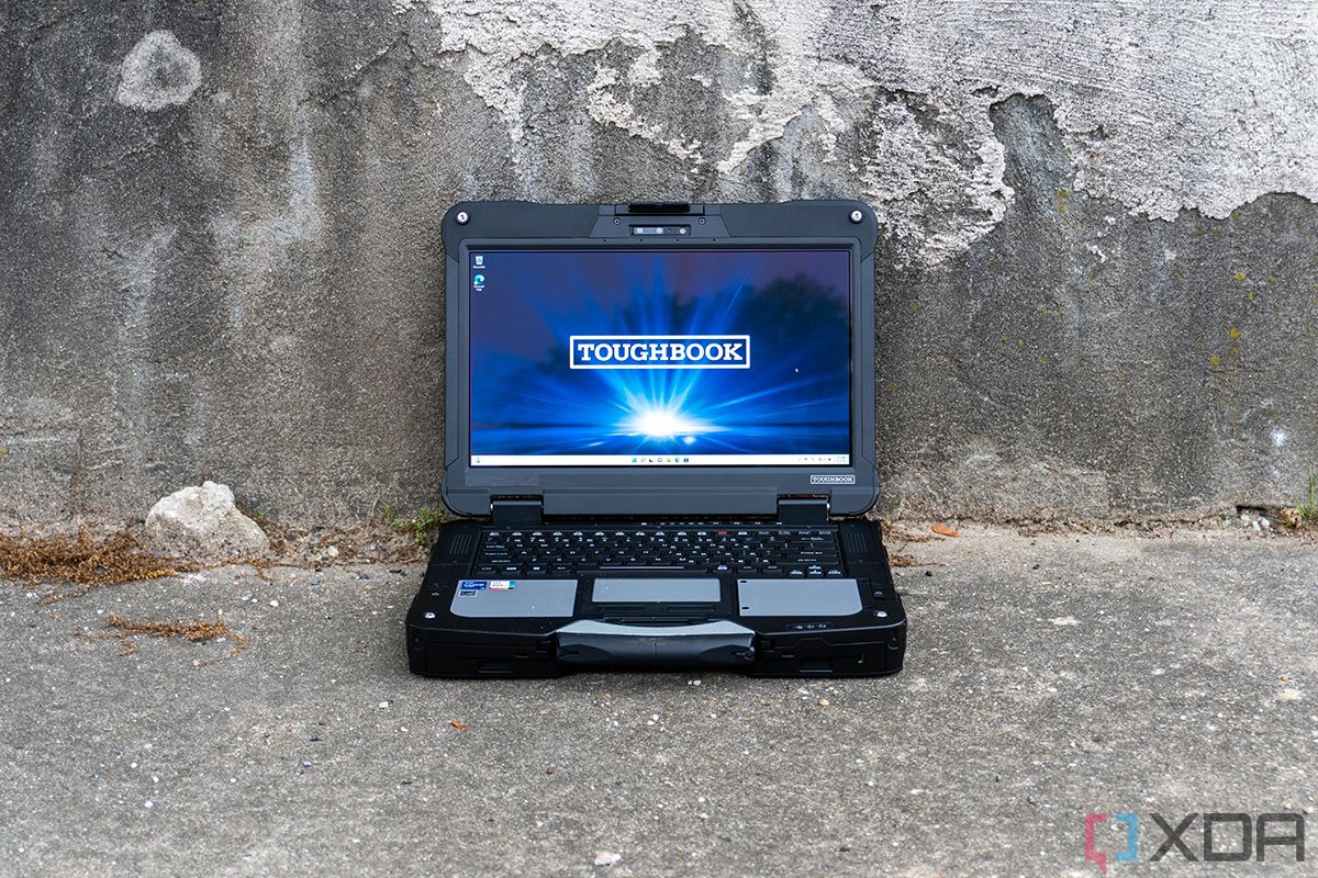 Front view of Panasonic laptop on concrete background