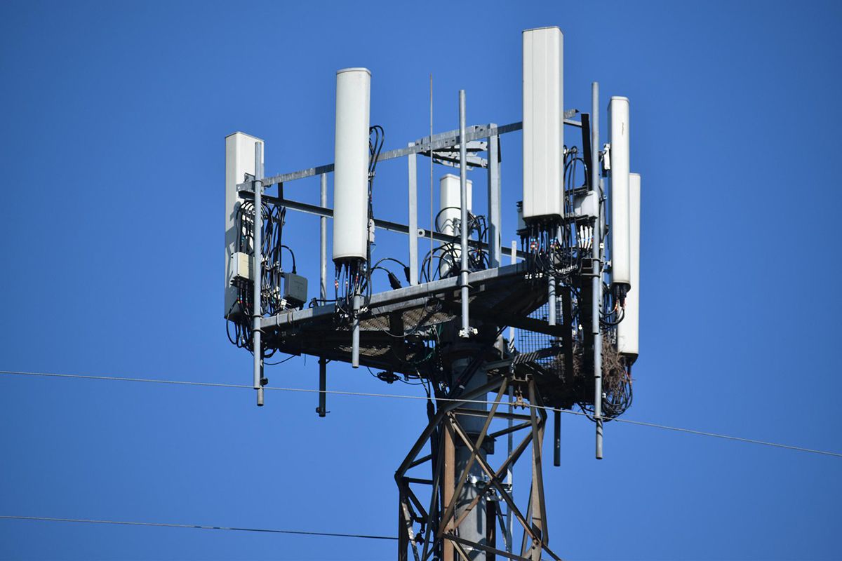 5G cell tower with clear blue sky in the background