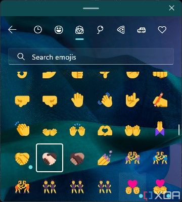 Emoji panel in Windows 11 22H2 with handshake emoji in multiple skin tone variations