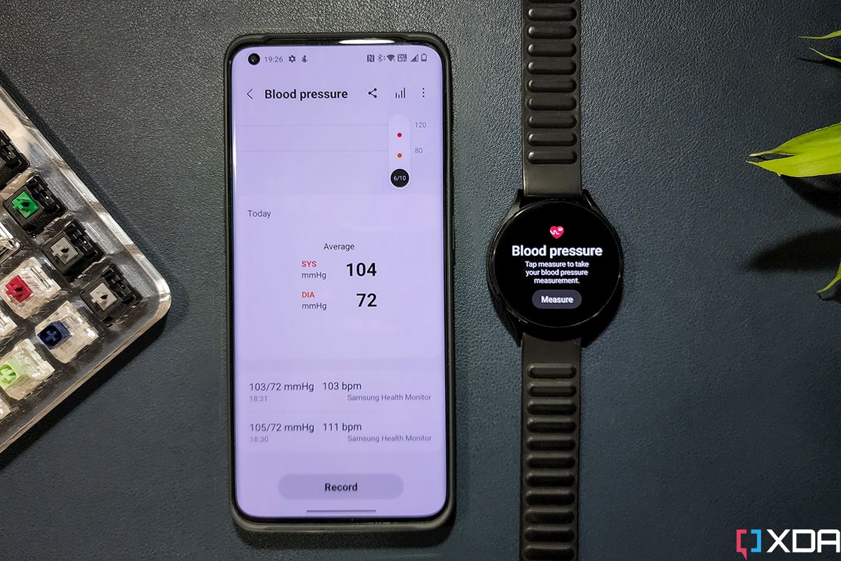 Galaxy Watch 4 next to OnePlus 10 Pro with BP sync feature on both screens