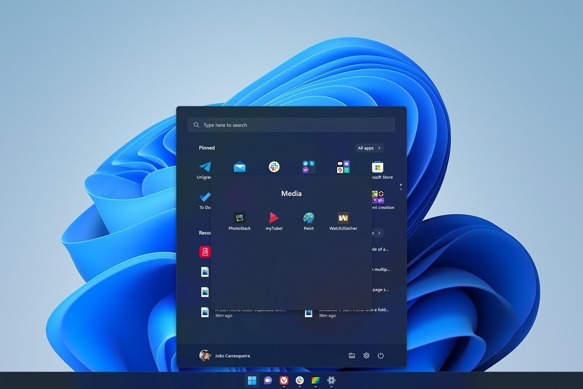 A Windows 11 desktop with the Start menu open and a folder inside expanded to show four apps inside